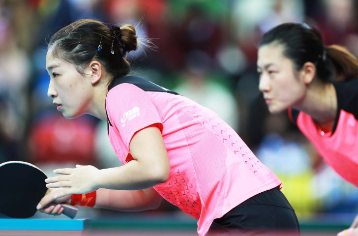 Liu Shiwen, left, and Olympic and world champion Ding Ning en route to victory in the opening doubles against Japan as China earned a tenth ITTF Team World Cup title at London's Copper Box Arena ©Getty Images 