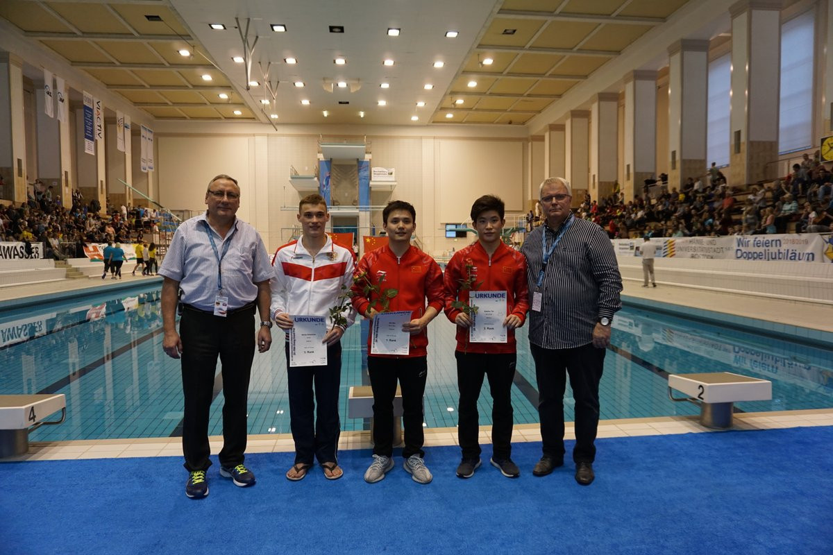 Bo Qiu, centre, touched perfection as China dominated the FiNA Diving Grand Prix in Rostock  ©Twitter