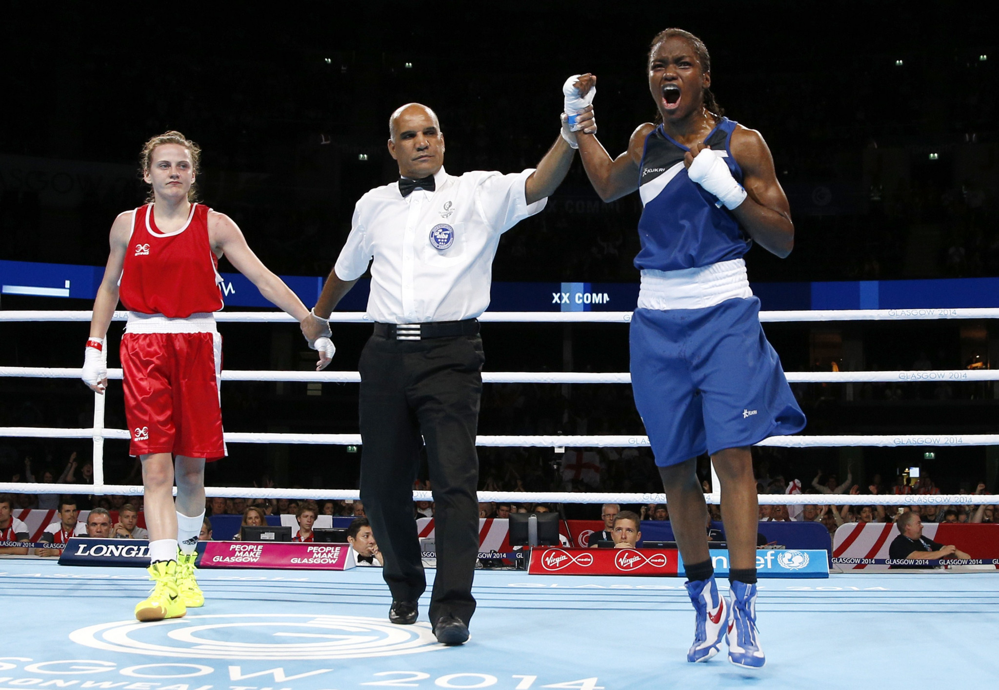 Nicola Adams celebrates after being announced as the Commonwealth Games gold medallist following a split decision over Northern Ireland's Michaela Walsh at Glasgow 2014 ©Getty Images