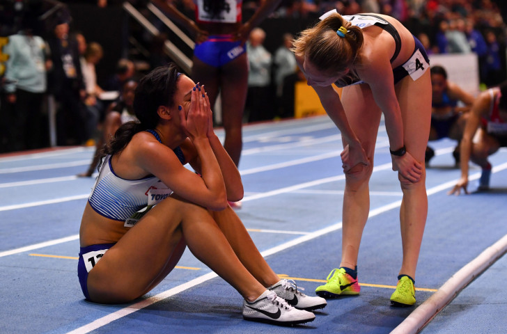 Britain's Katarina Johnson-Thompson, left, reacts after winning her first global title in the pentathlon at Arena Birmingham ©Getty Images